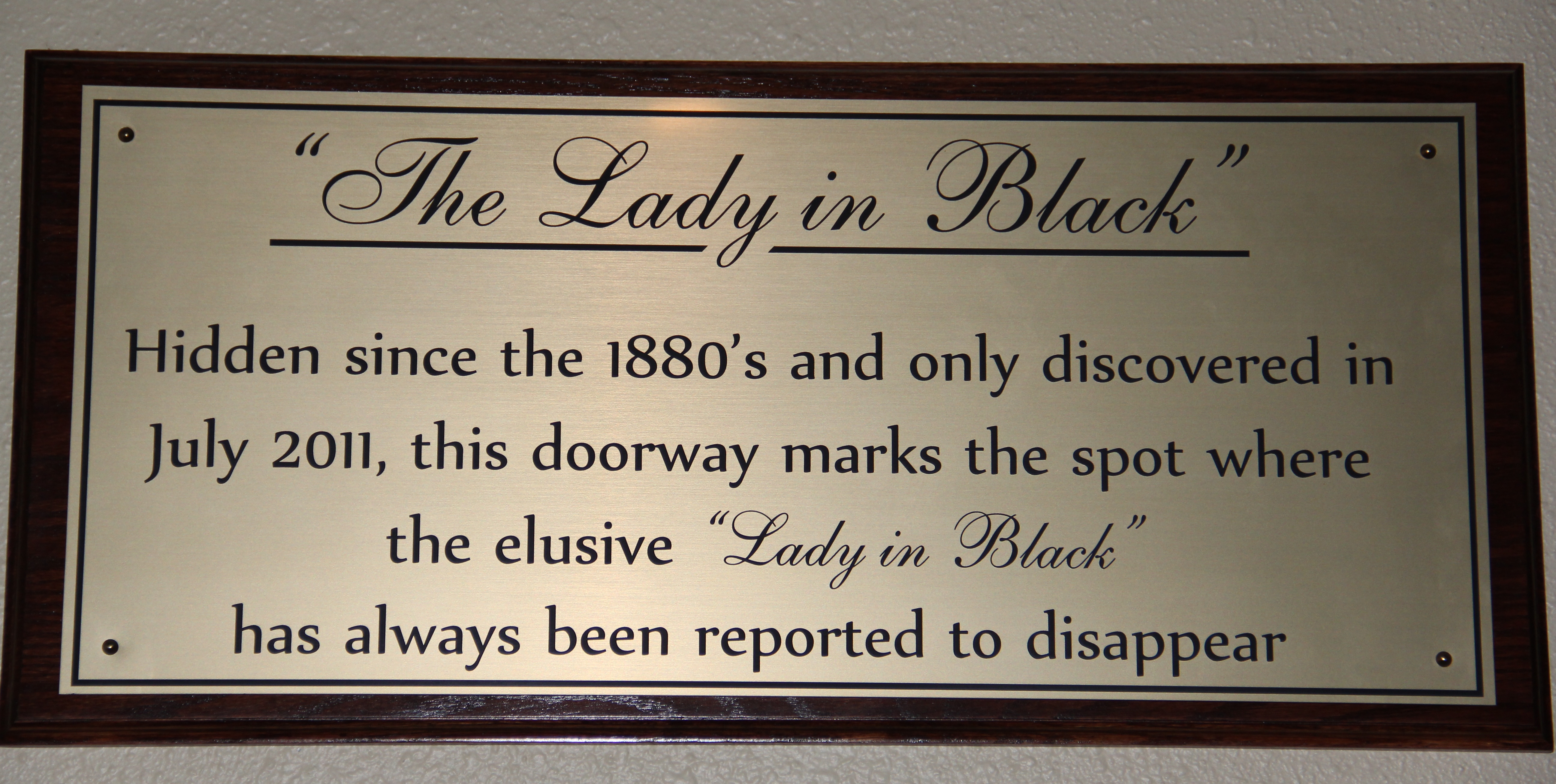 Lady in Black Sign