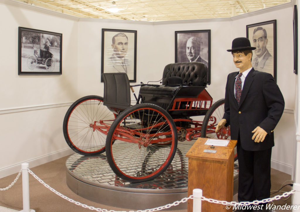 Likeness of Elwood Haynes and the first practical, purpose built automobile.