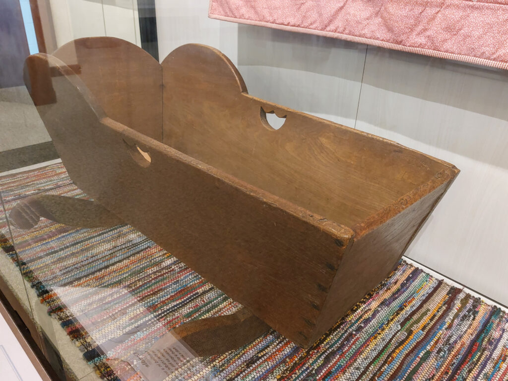 Herbert Hoover's baby cradle in the visitor's center at the Herbert Hoover National Historic Site