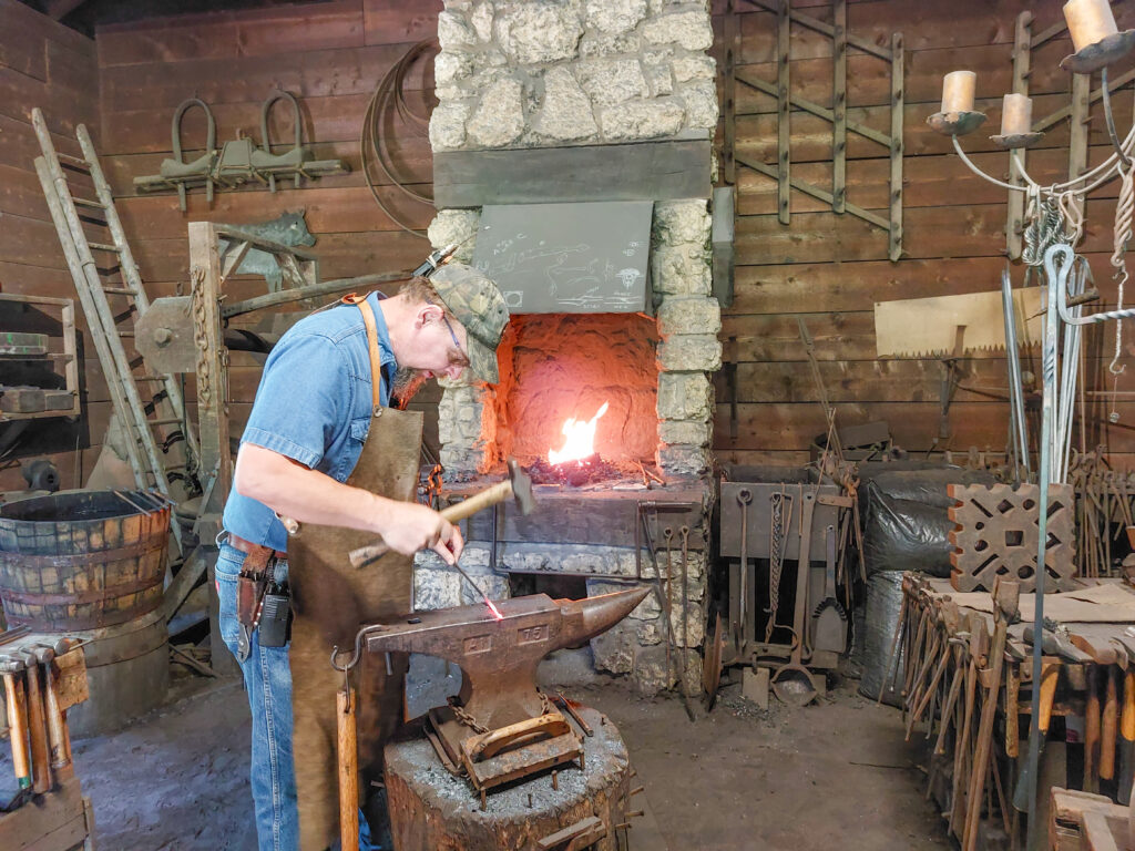 A blacksmith demonstrates the craft