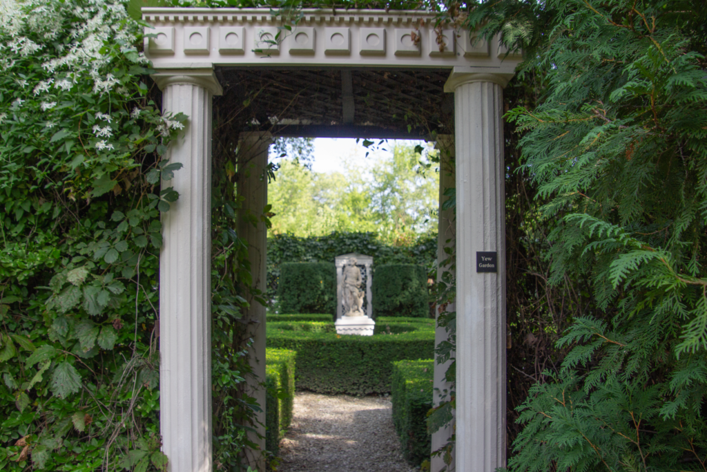 Entering the Yew Garden through a pillared arbpr