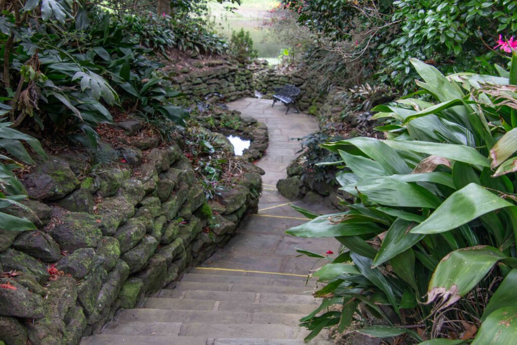 A garden path lined with stone walls