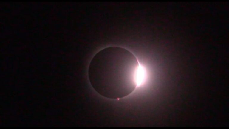A photo of the 2024 coming out of totality. The bit of sun shining through, with the ring of sun around the moon, resembles a diamond ring.