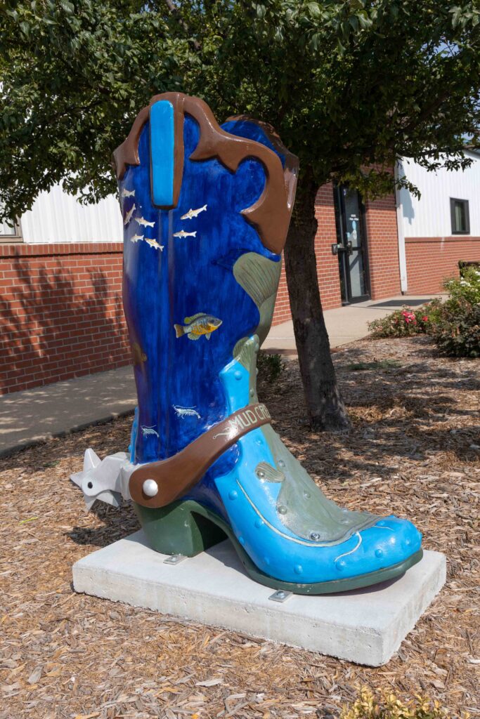 Cowboy boot decorated with fish