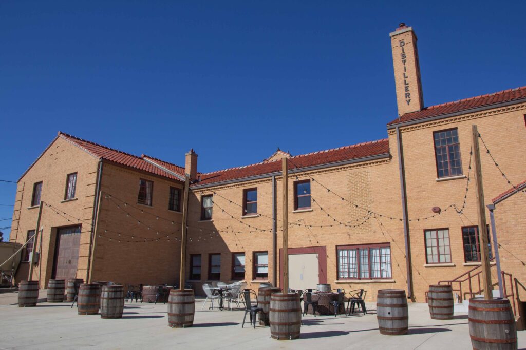 The back of Boot Hill Distillery with outdoor seating