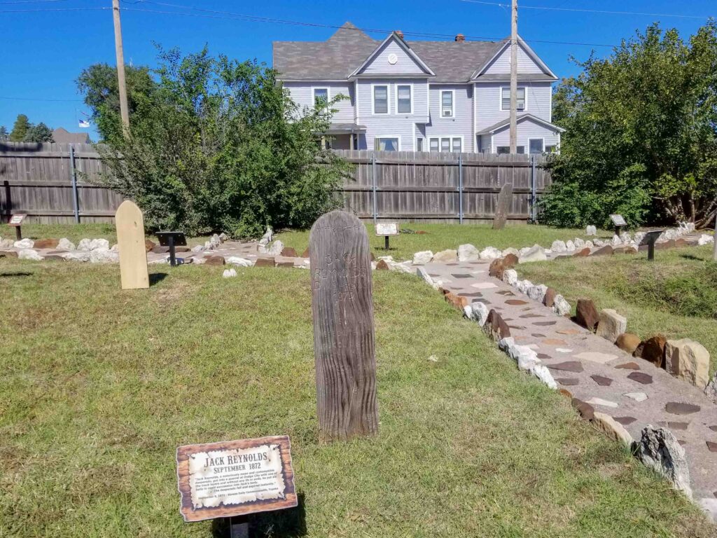 Boot Hill Cemetery with grave markers and a small stone walking path