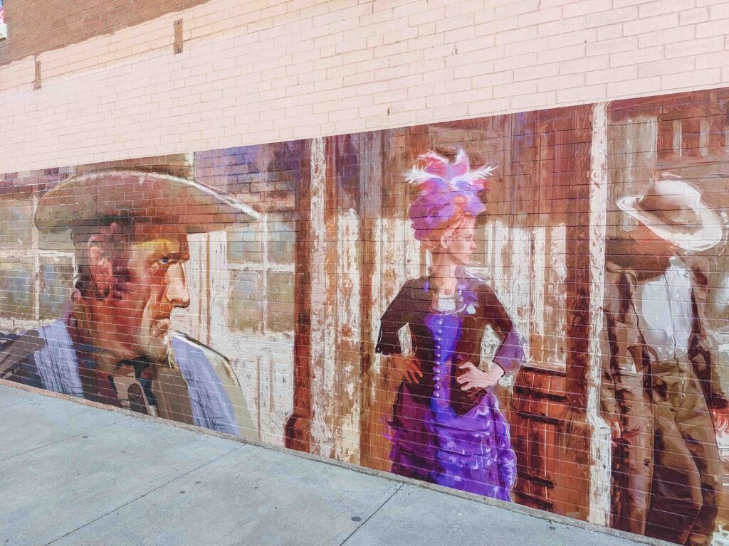 Mural depicting Old West characters as in the Gunsmoke series